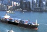 Container ship passing a city skyline